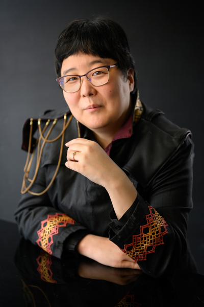 author photo of Yoon Ha Lee in a military-style jacket